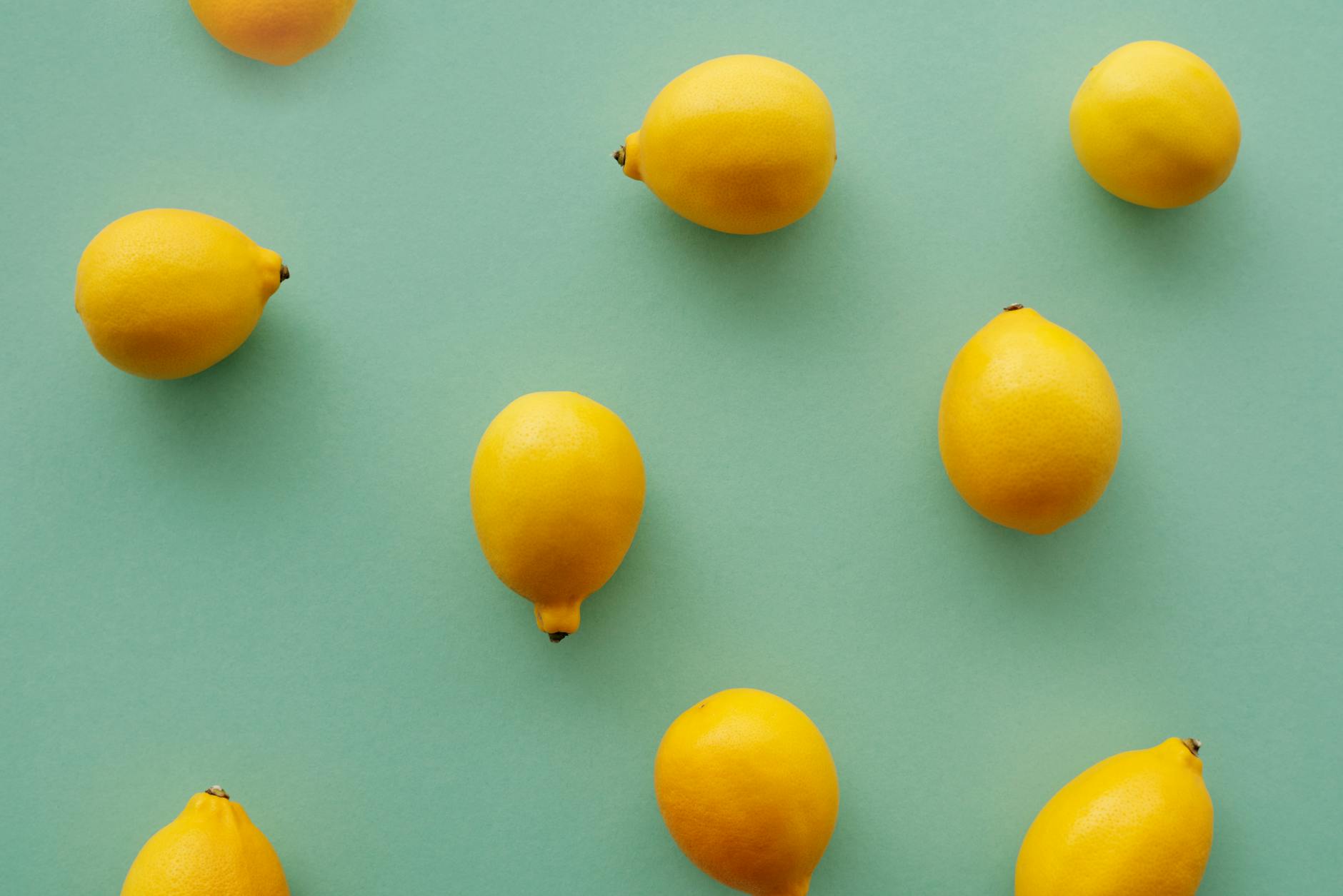 Bright yellow lemons on a pastel background, symbolizing fresh starts and renewal